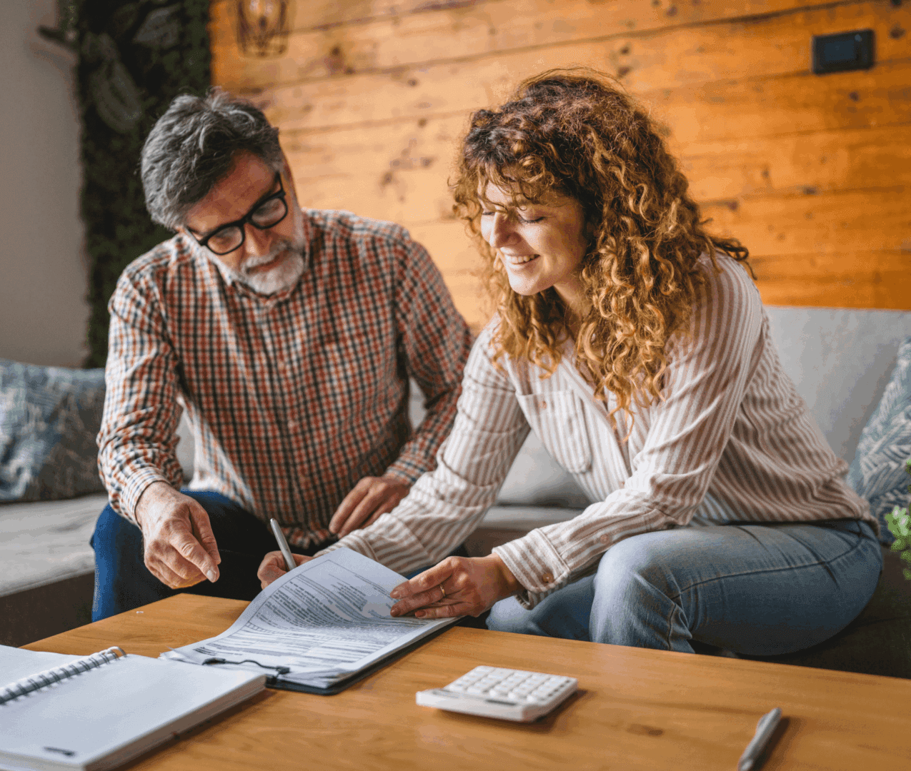 Man and woman reviewing documents together.