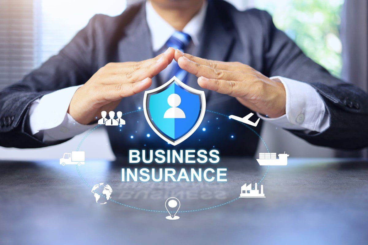 Business insurance concept with protective hands.