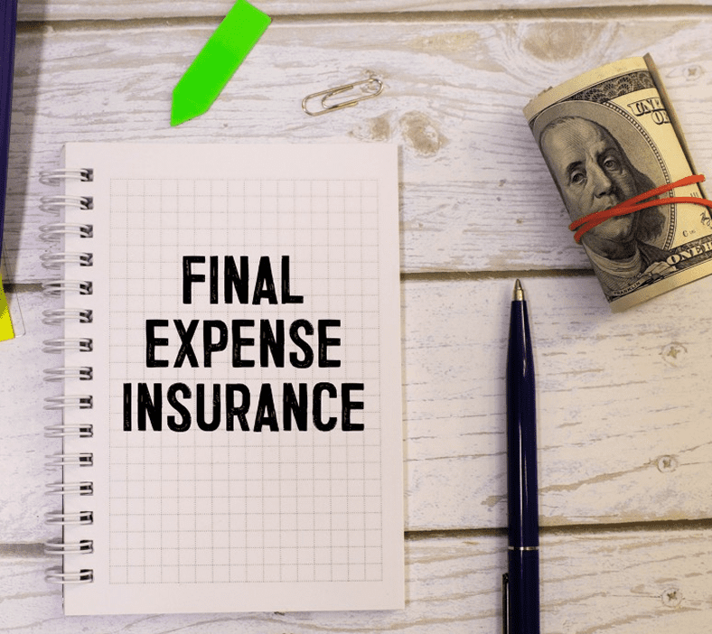 Final expense insurance notebook with money.